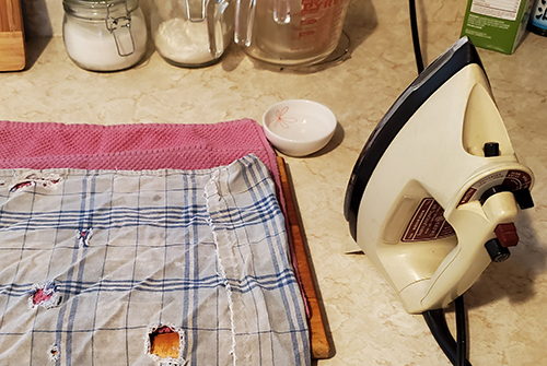 fabric on a counter next to an iron