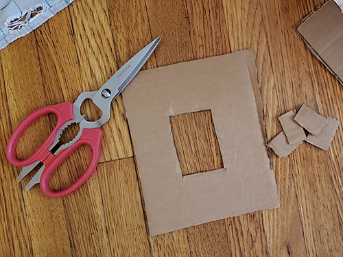 cutting out a cardboard frame