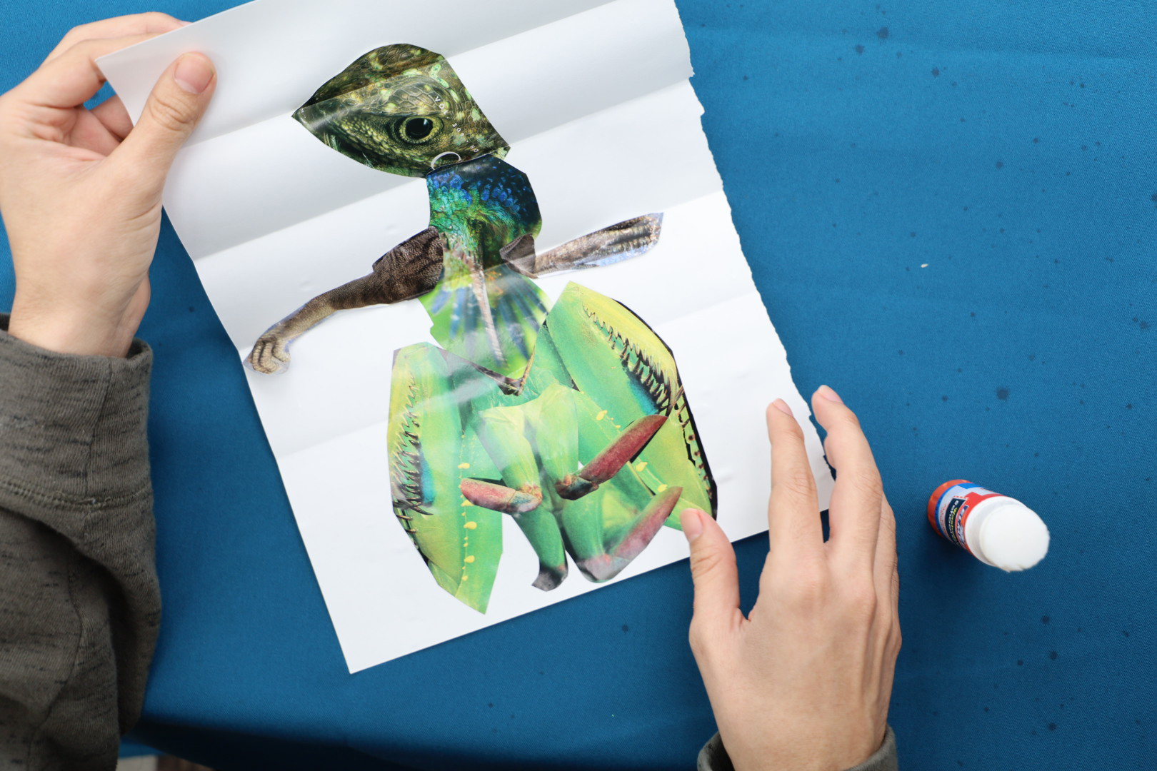 paper unfolded to show the entire composite, collaborative creature