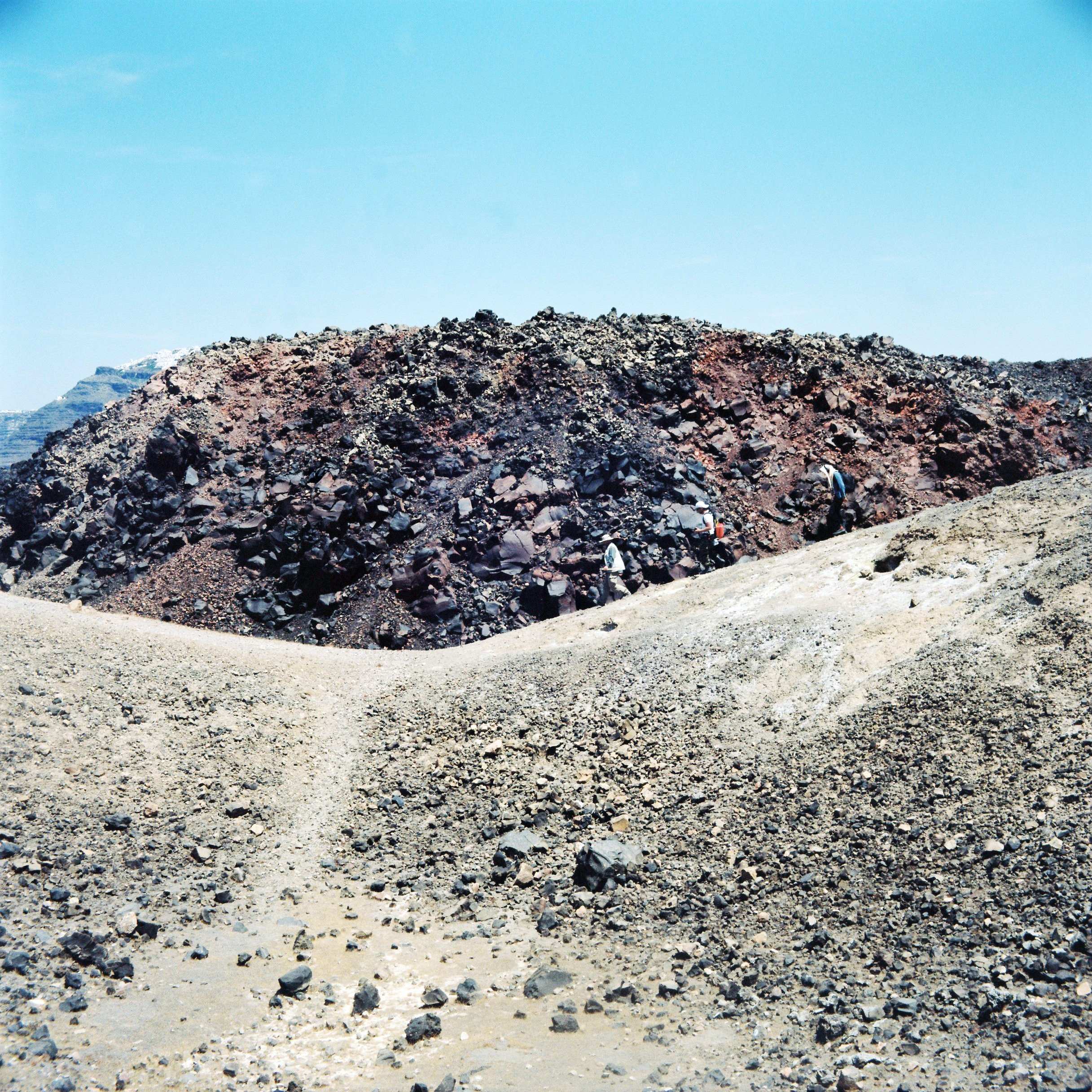 Tamm working with members of the Institute for the Study and Monitoring of the Santorini Volcano (ISMOSAV) for Tympanic Tether; photograph by Hermione Spriggs, 2015