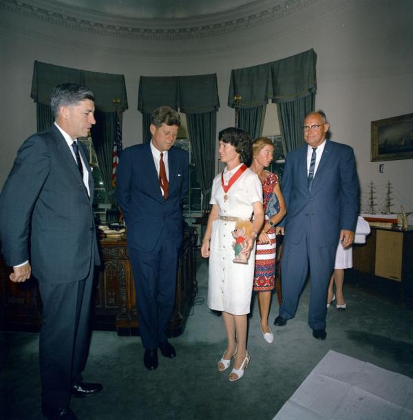 Photo of group of people in the Oval Office