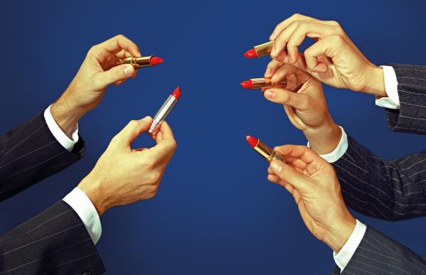 Five identical hands holding lipstick