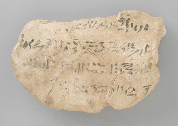 Stone tablet with faded symbols