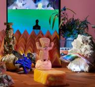 Diorama with sculptures, objects, and video