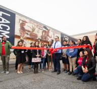 Principal Cuevas of Bell Gardens Intermediate cuts the ribbon on March 11, 2019, photo by Stephenie Pashkowsky