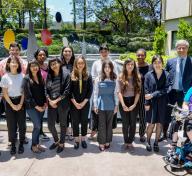 Mellon Academy participants standing in front of Calder sculpture with LACMA Director Michael Govan