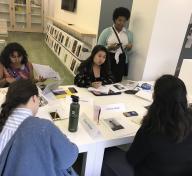 The 2019 Mellon Summer Academy students: Jenebrith Pastran, Emily Le, JaBrea Patterson-West (advisor), Melissa San Miguel, Victoria Vargas, and Eavan McNeil discussing their selected photographs